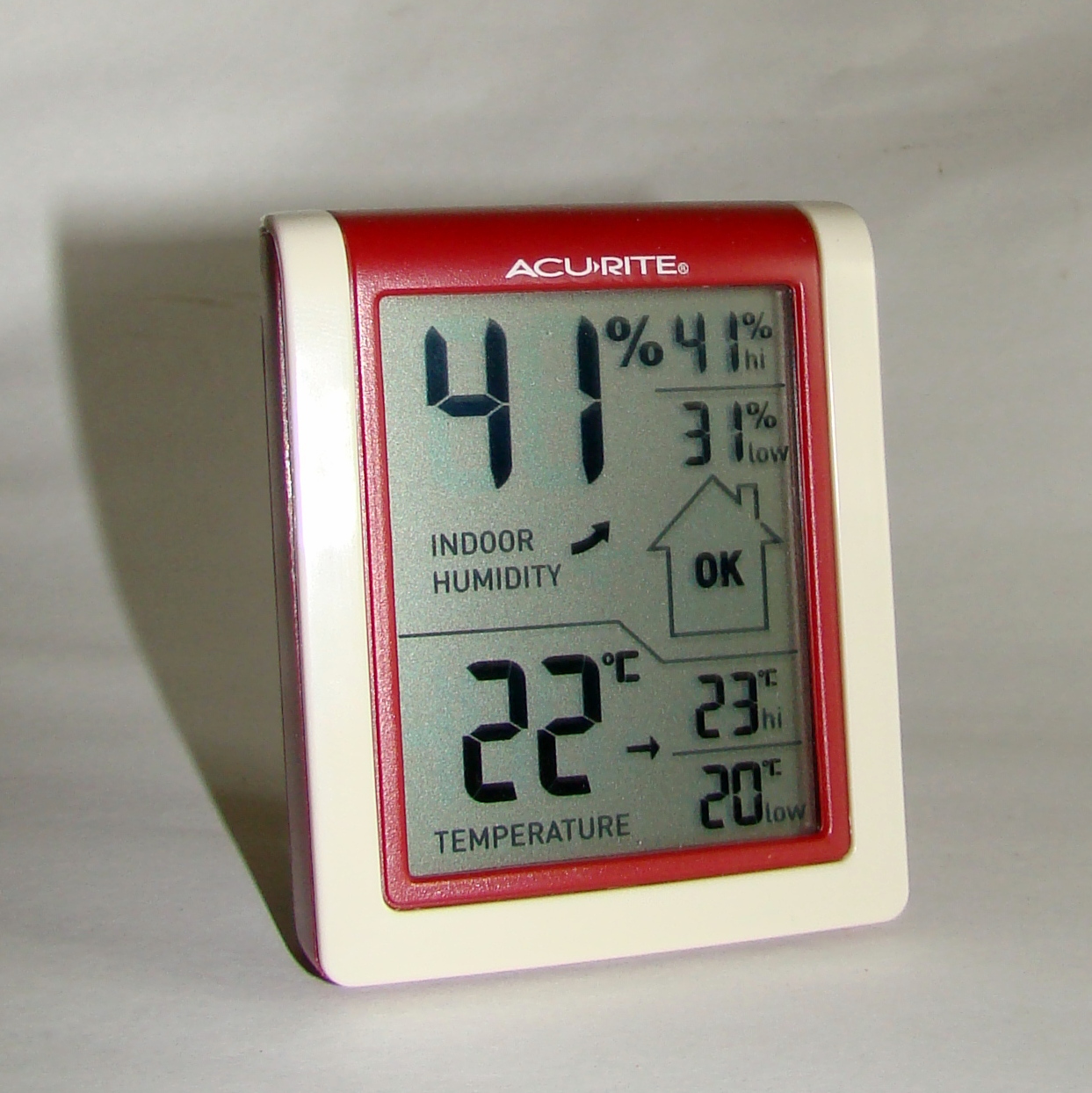 A thermometer and hygrometer used to monitor room conditions